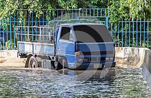 Truck driving on flooded road