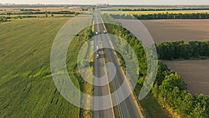 Truck driving highway sun sunset road transport forest field aerial