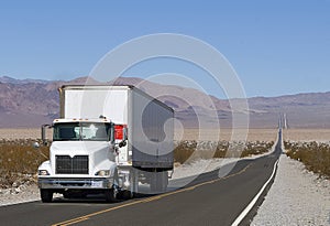 Truck driving on a lonely road