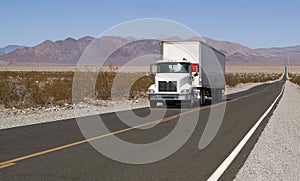 Truck driving on a lonely road