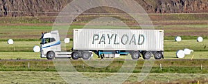 Truck driving through a rural area - Payload photo