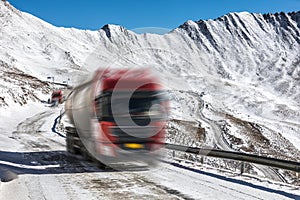 Truck driving on uphill in mountain at winter