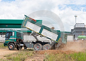 Truck dump load out soil to construciton site