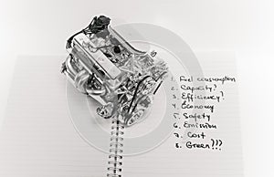 truck engine sitting on open notebook