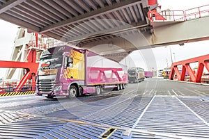 Truck entering inside the embarkment ferryboat bridge