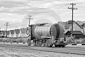 Truck with fuel tanker at road