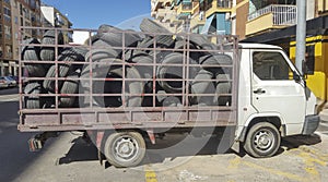 A truck full of old tyres for recycling