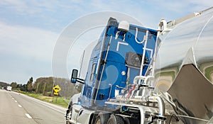 Truck for gas or liquids on a highway in US, closeup side view