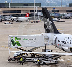 Truck of Gate Gourmet at an Airbus of Star Alliance in the Zurich Airport