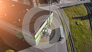 The truck goes to the logistics center top view aerial photography from a drone