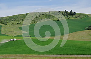 A truck going through farmlands