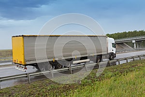 Truck going on the highway to rain