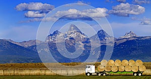 Truck Hauling Hay with Teton Mountains in Background