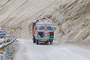 Truck on the high altitude Srinagar - Leh road in Lamayuru valley, state of Ladakh, Indian Himalayas, India