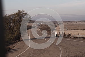 Truck on highway on desert