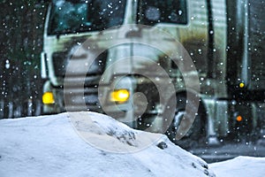 Truck on a highway during heavy snow storm