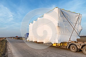 Truck with large oversized cargo on rural road photo