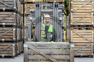 Truck is loaded with containers full of apples, ready to be sent to market