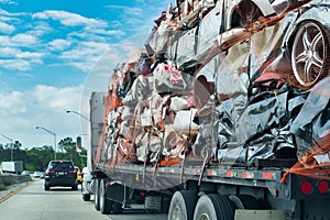 truck loaded with crushed cars