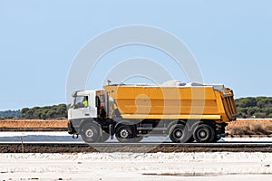 Truck loaded with marine salt. Traditional Sea salt production is salt that is produced by the evaporation of seawater