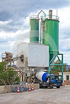 Truck is loading on cement factory.