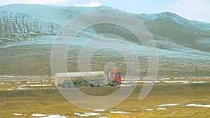 Truck of a local Chinese shipping company carrying liquid cargo across Tibet.