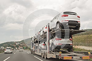 A Truck Making Transportation and Carries Cars For Selling on the Road