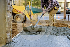 Truck mixer pouring concrete cement for construction sidewalk