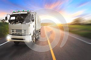 Truck on motorway in beautiful sunset light