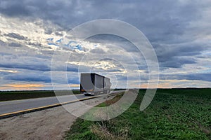 Truck on the motorway at sunset