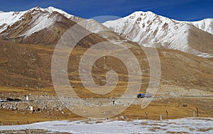 Truck and mountains at Khunjerab pass at china-pakistan border i