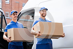 Truck Movers Loading Van Carrying Boxes