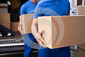 Truck Movers Loading Van Carrying Boxes