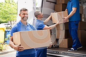 Truck Movers Loading Van Carrying Boxes photo