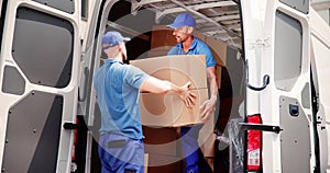Truck Movers Loading Van Carrying Boxes