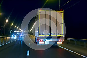 truck moves on highway at night