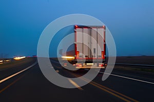 Truck moves on highway at night