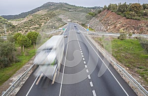 Truck moves at spanish national road with slow vehicles lane photo