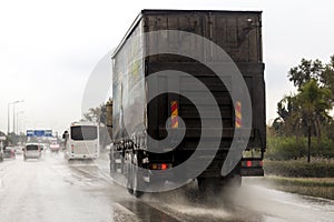 Truck moving fast in the rain