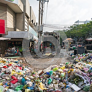 Truck moving landfill garbage, rubbish on the street