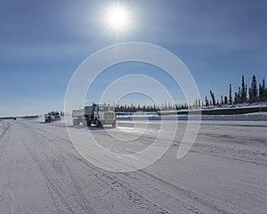 Truck Moving on the Mackenzie River Ice Road photo