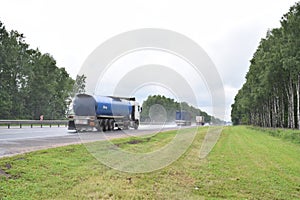 The truck is moving very fast along the motorway