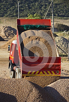 Truck offloading gravel photo