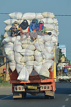 Truck overloaded with rice sacks