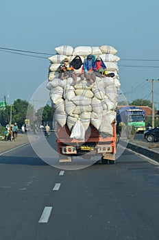 Truck overloaded with rice sacks