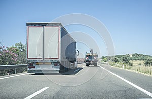 Truck overtaking slowly another truck