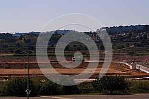 A truck passes by a zone under construction