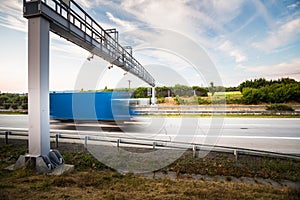 Truck passing through a toll gate on a highway