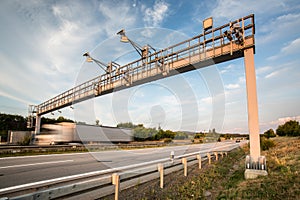 Truck passing through a toll gate on a highway