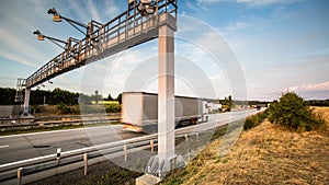 Truck passing through a toll gate on a highway